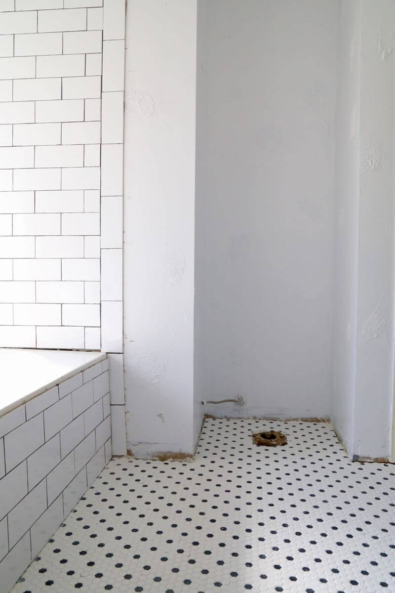 This bathroom renovation is going to be amazing. The black and white tile in this room is so clean and modern! There are some great tips for tiling in this post, too. This One Room Challenge makeover is going to be absolutely amazing.