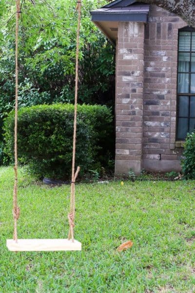 How to build a quick and simple wood tree swing for young kids - it costs about $10 and takes less than an hour to put together! Easy, affordable ideas for outdoor play.