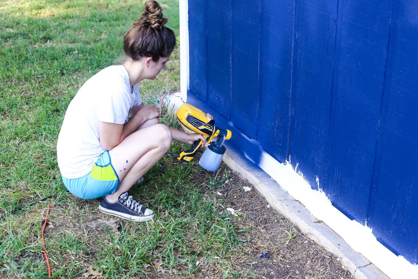 How to paint an exterior building using a paint sprayer - it will make a huge difference in how your entire yard looks and feels! 