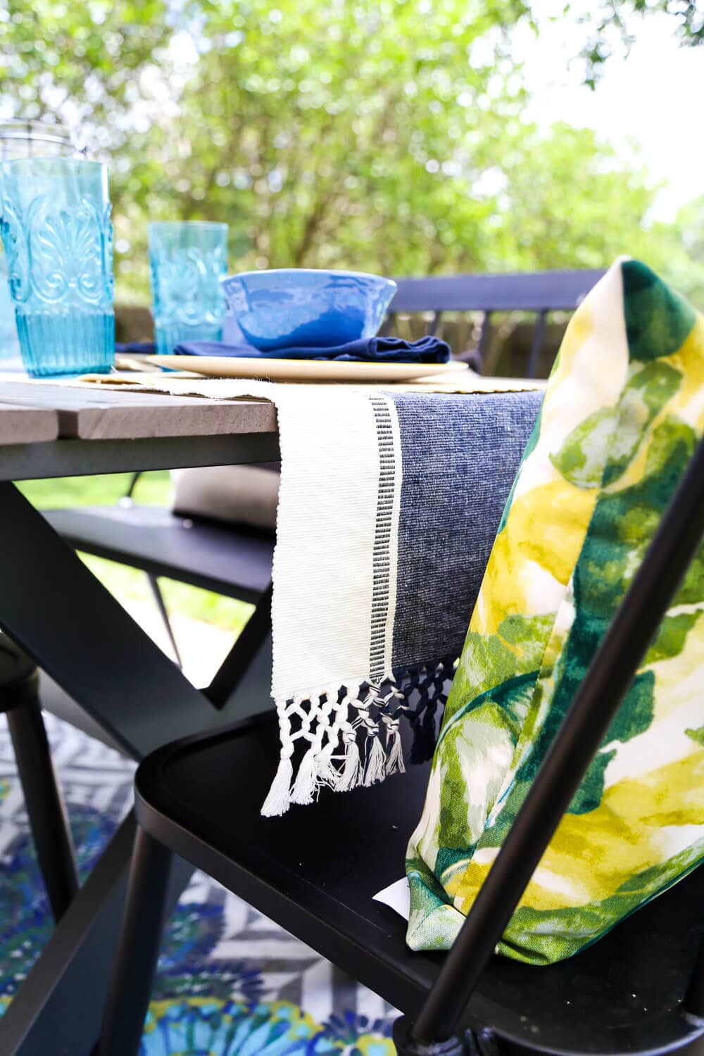 This patio is so gorgeous and cozy - and everything out here is so affordable! There are some great ideas for making a small patio feel spacious, and tips for choosing outdoor furniture. 