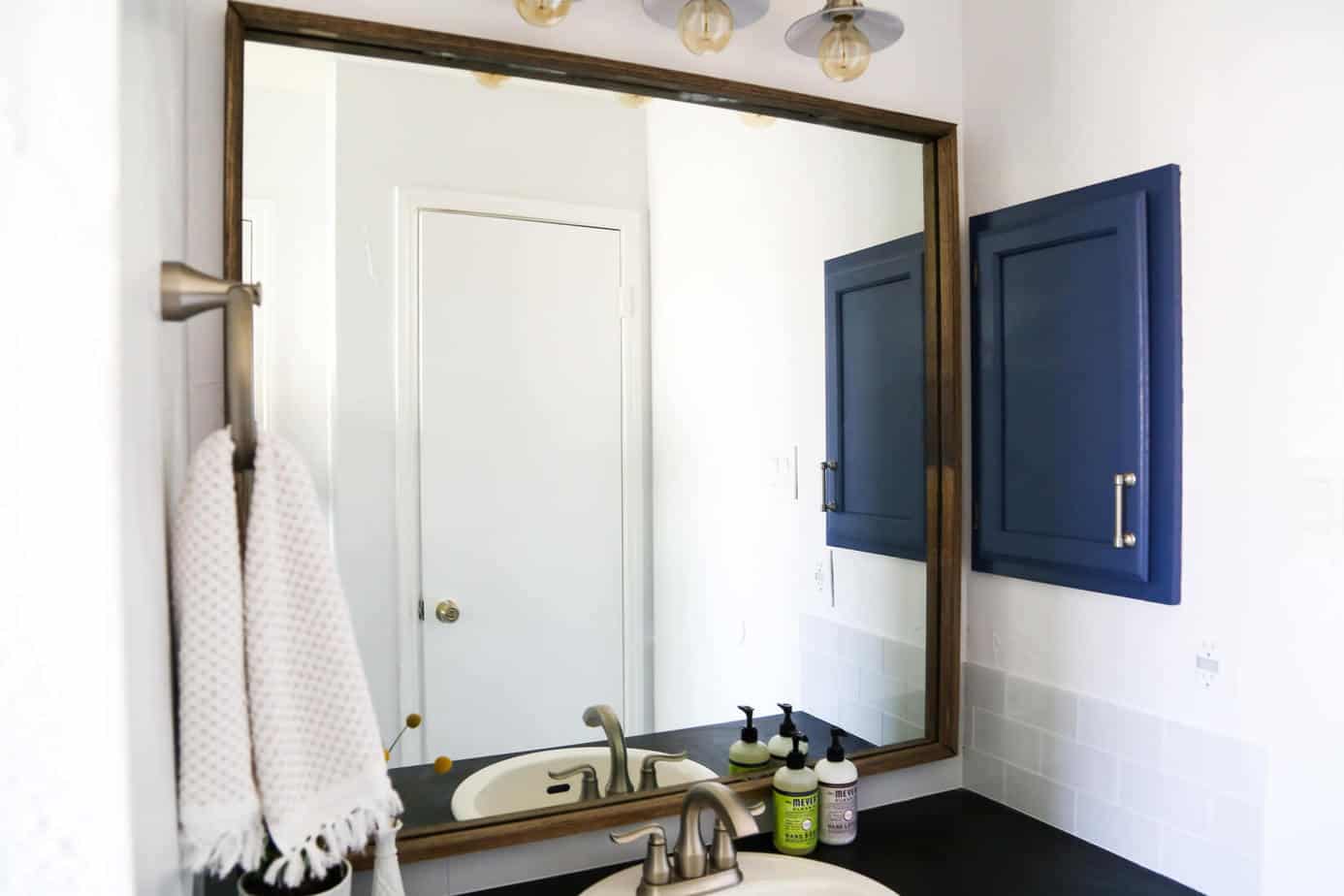 How to quickly and easily frame a bathroom mirror, to take your bathroom from builder-grade to completely custom!