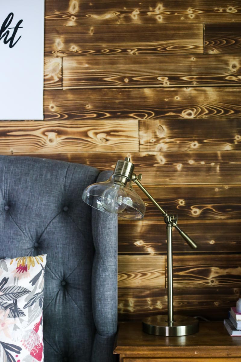 A beautiful DIY wood planked accent wall made with Home Depot's appearance boards