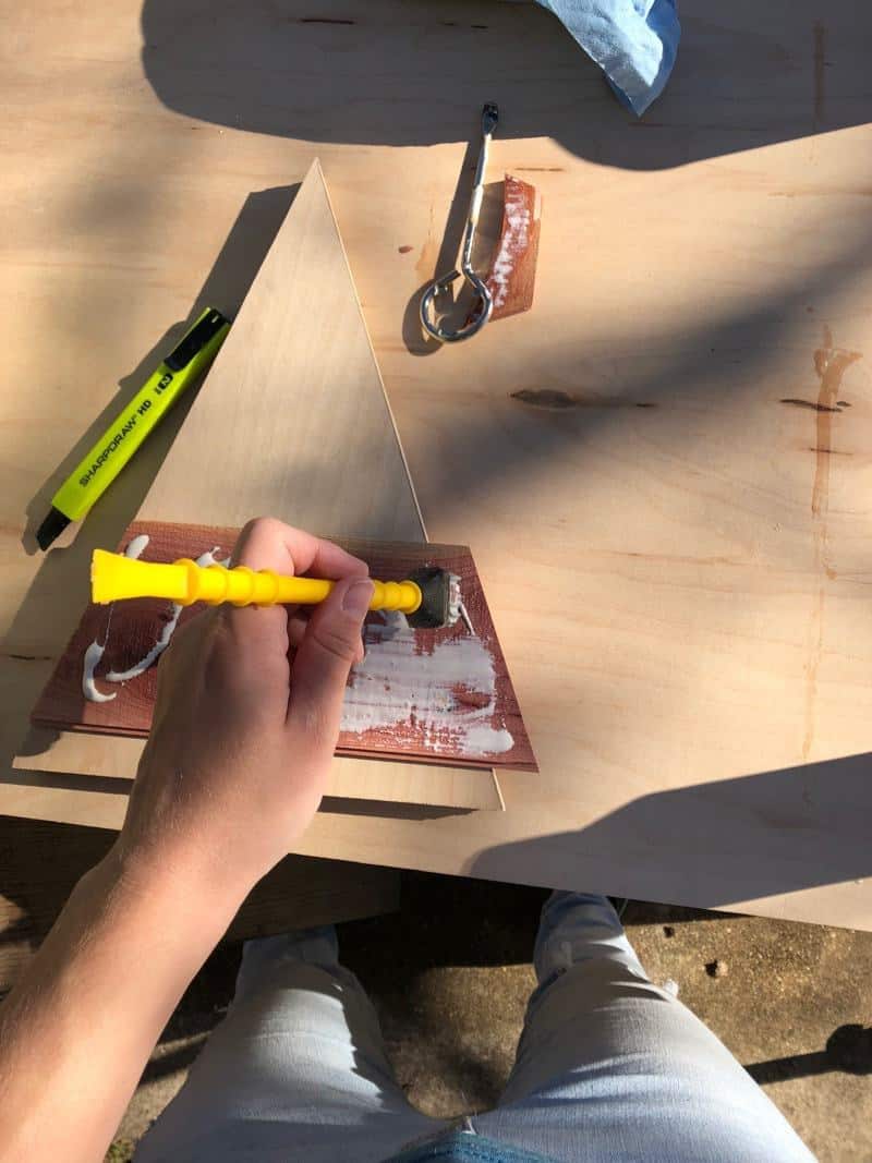 adding glue to cedar planks