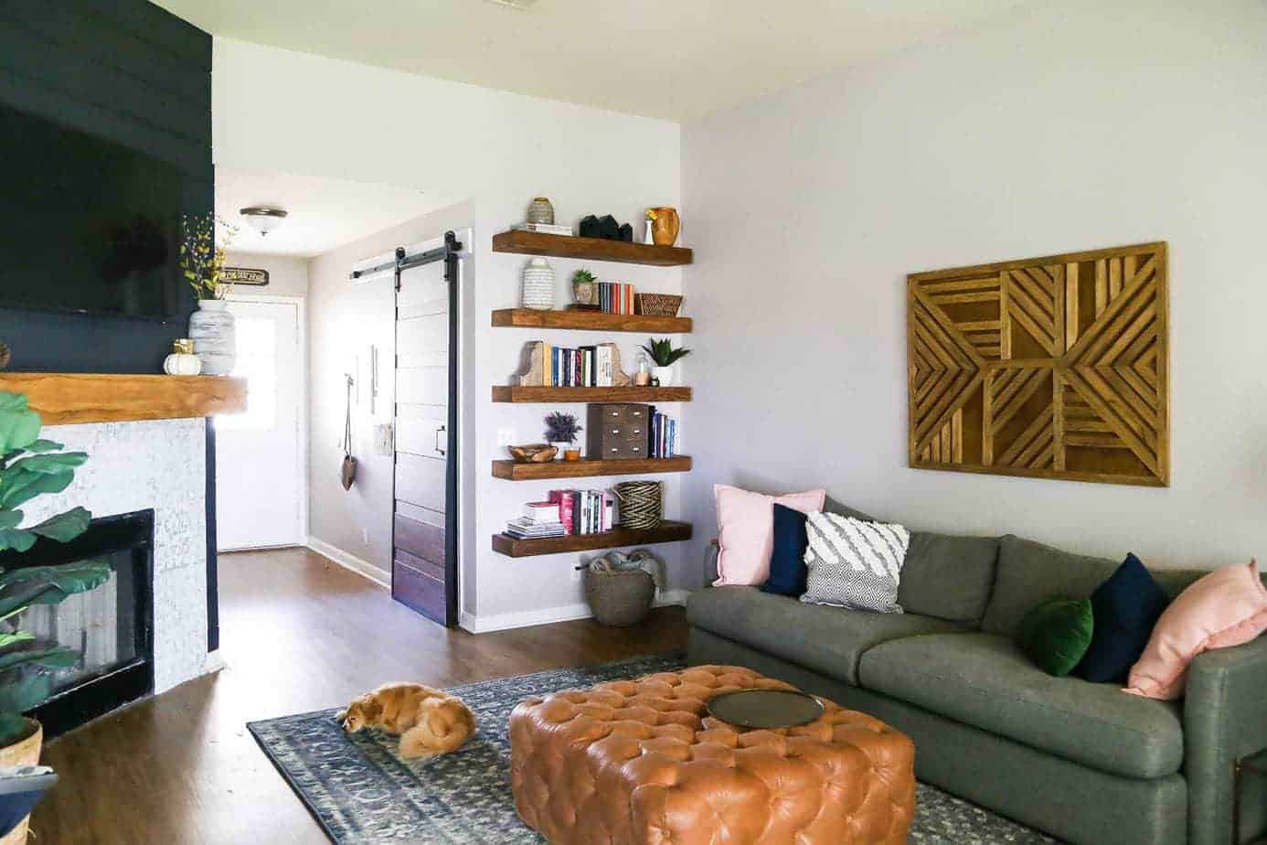 living room with styled open shelving