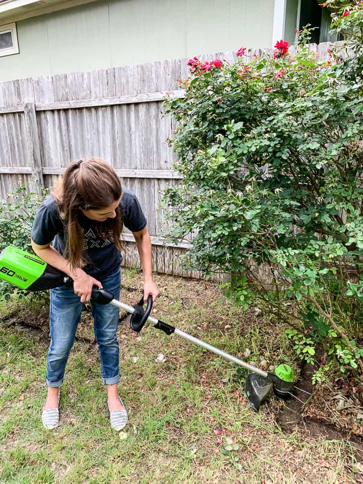 woman using a string trimmer 
