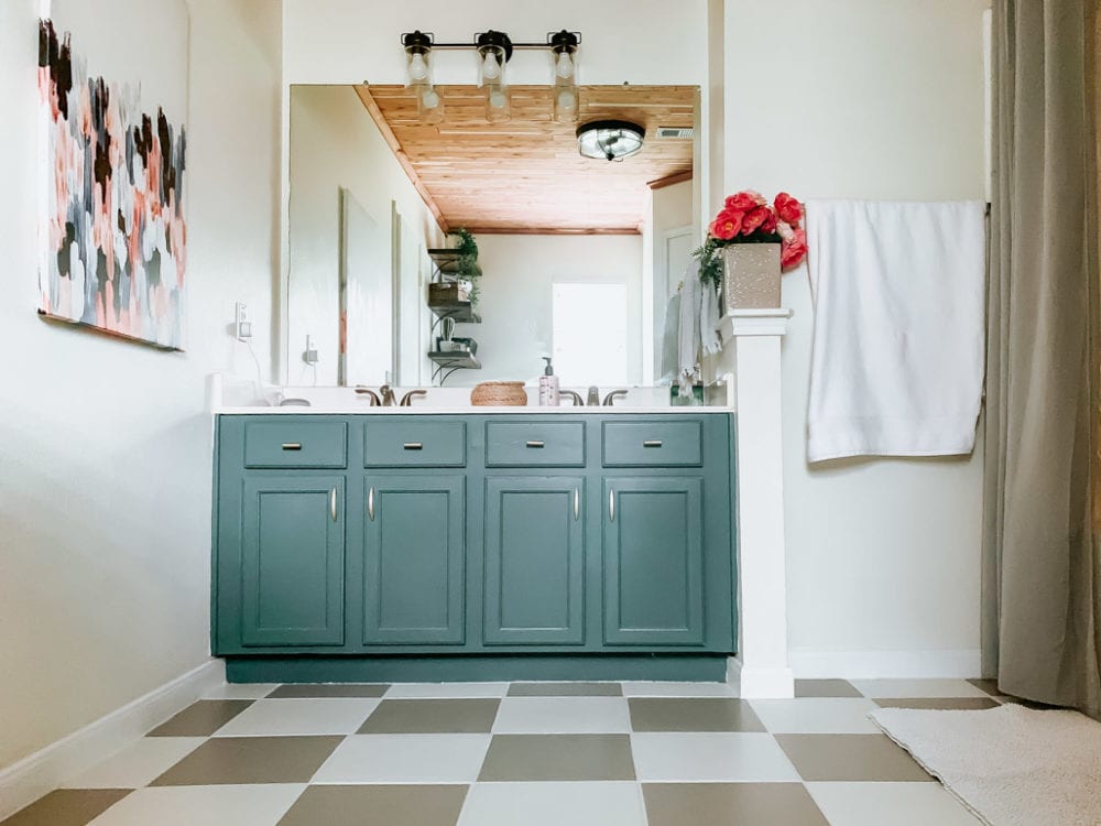 bathroom with DIY painted tile flooring