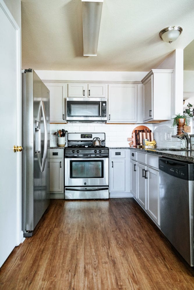 a kitchen with greige kitchen cabinets
