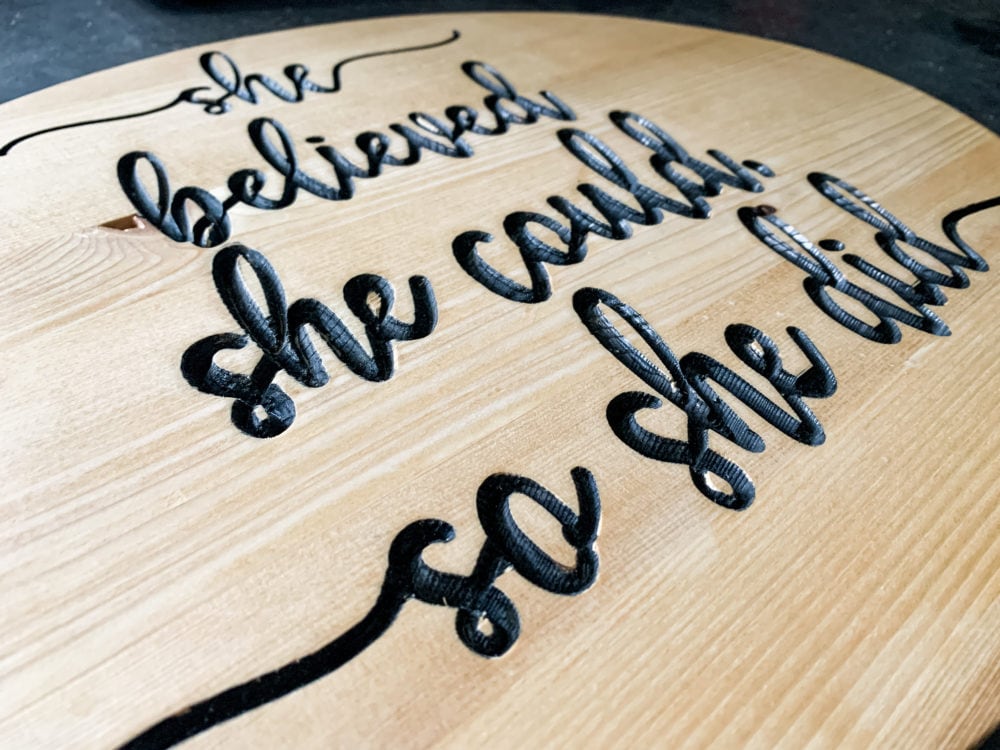 close up of DIY wood carved sign 
