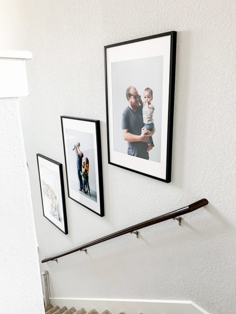 Trio of family photos in a stairwell
