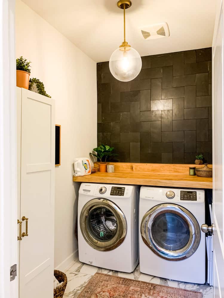 laundry room with basalt tile