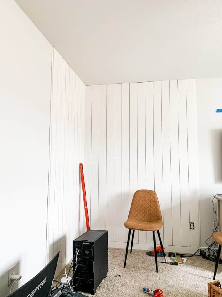 Corner of a room with vertical shiplap