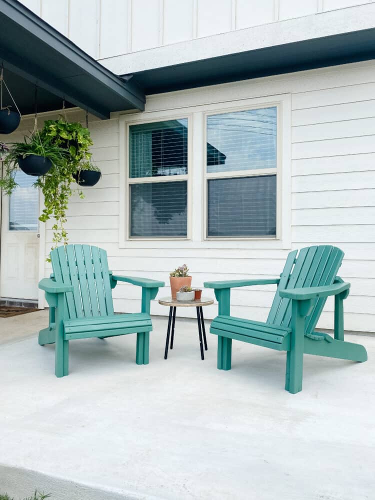 blue DIY Adirondack chairs on a patio