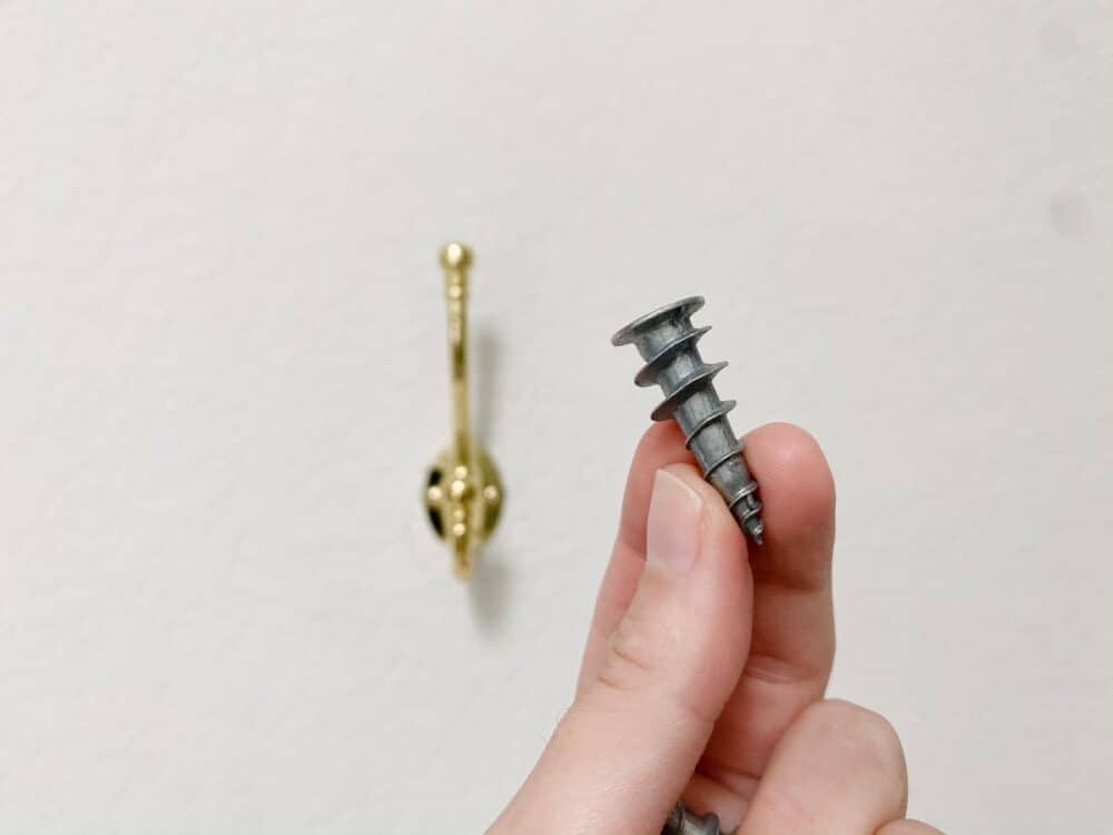 close up image of a metal self-drilling drywall anchor