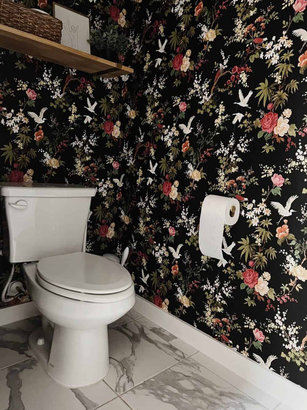 Toilet in a powder room with floral wallpaper