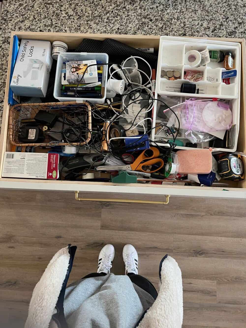 a junk drawer prior to being organized 