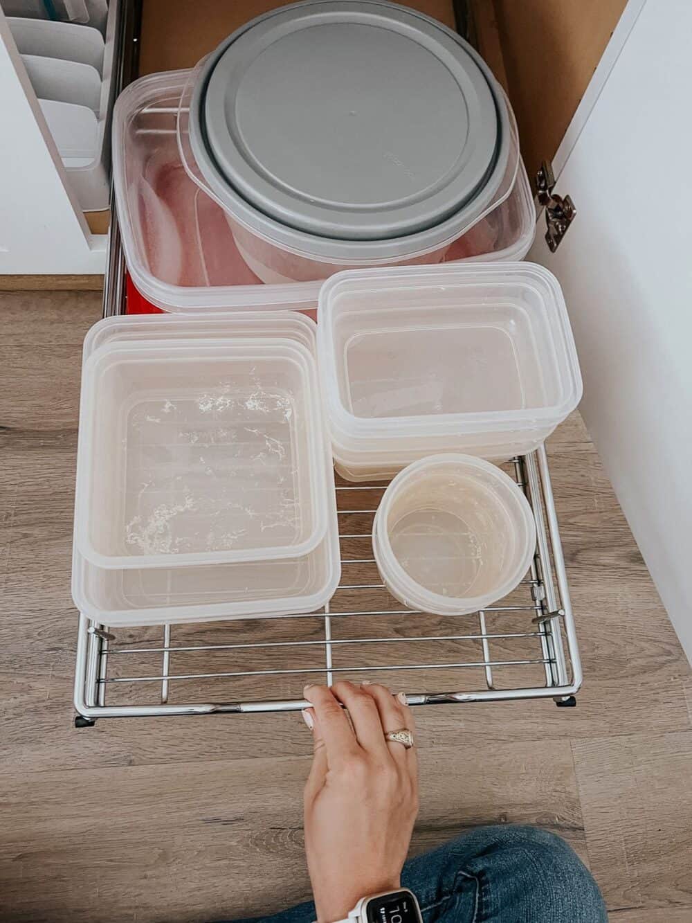 Cabinet pull-out shelf with food storage containers 