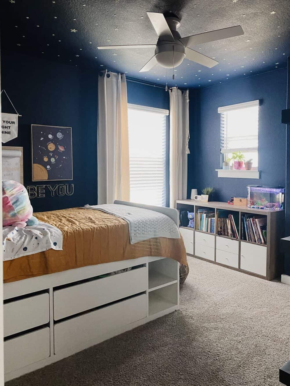 kids' space themed bedroom wit painted ceiling 