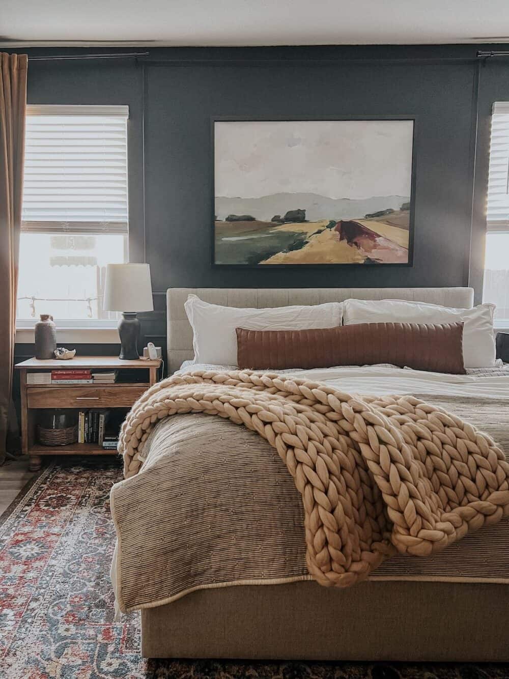 bedroom with a cozy throw on the foot of the bed 