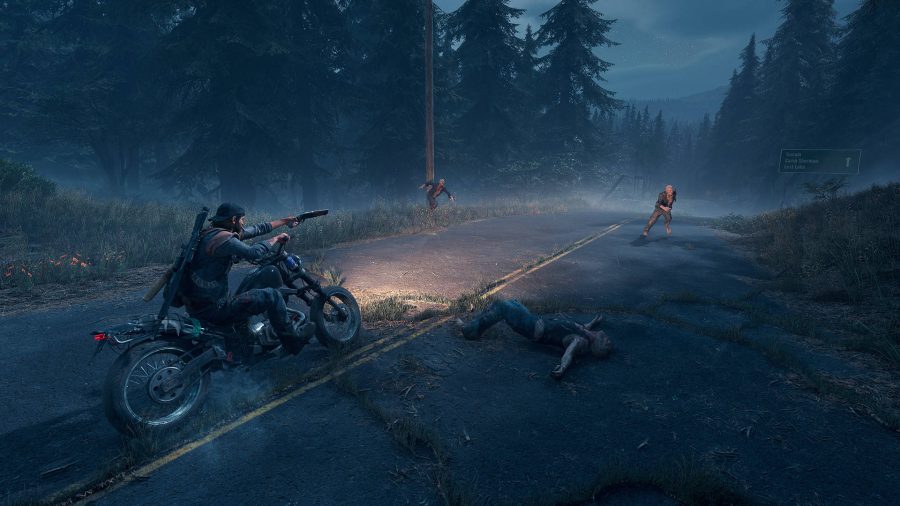 Riding a motorbike in Days Gone, one of the best open world games, all while shooting zombies.