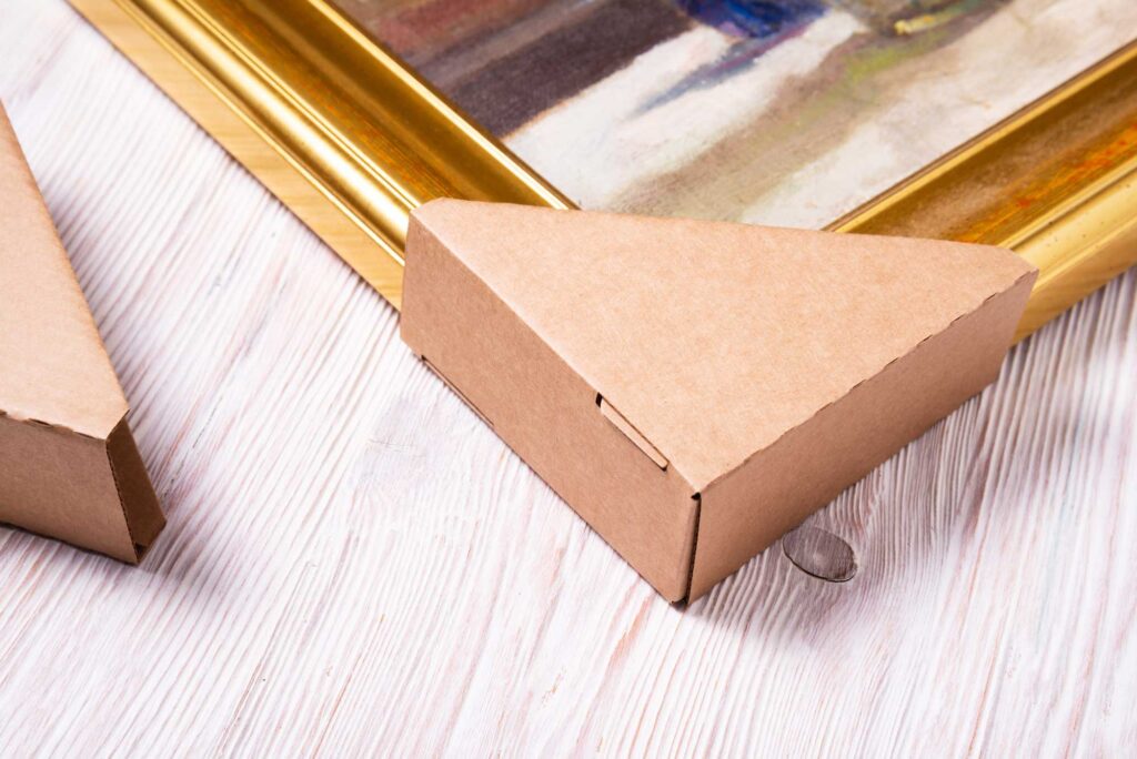 Brown cardboard carton picture frame corner protectors