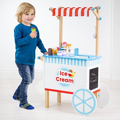 boy pushing bigjigs wooden ice cream trolley