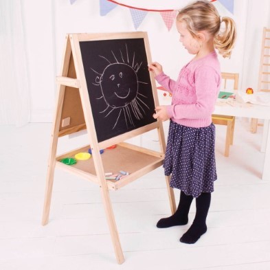 Girl drawing on chalkboard