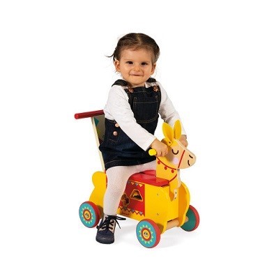 kid riding toy llama