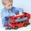 boy with london bus toy