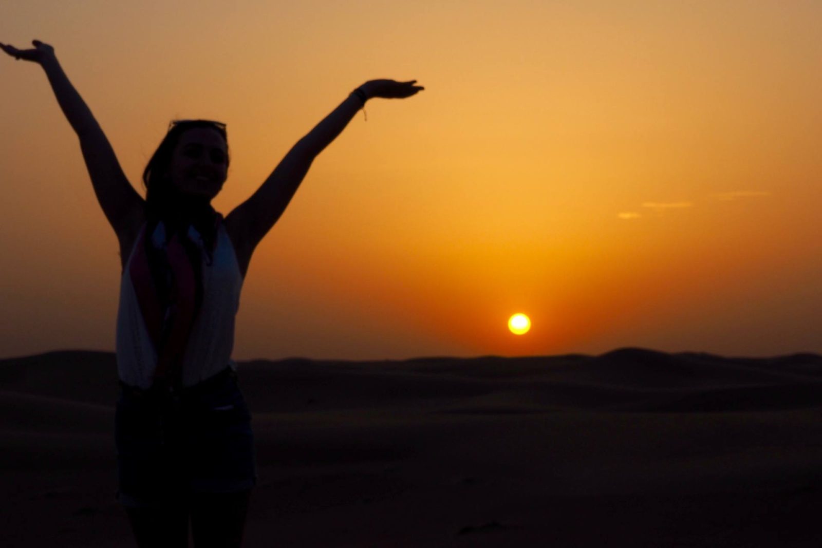 girl shadow in the desert at sunset