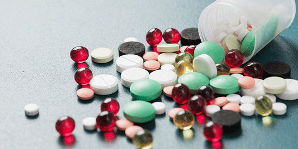 various Pharmaceutical medicine pills on table