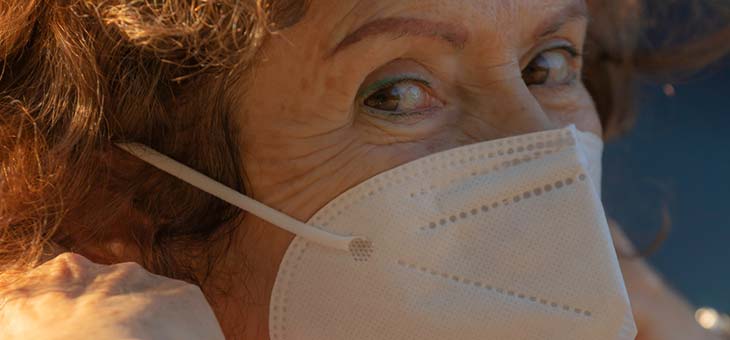 older woman wearing a covid mask