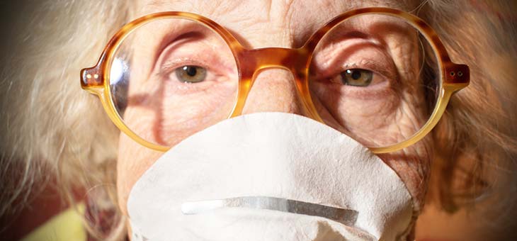 older woman wearing a surgical mask