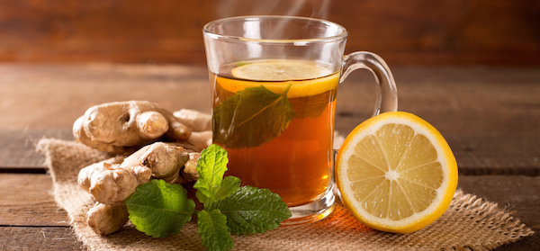 Glass of ginger and lemon tea which is a natural remedy for a sore throat