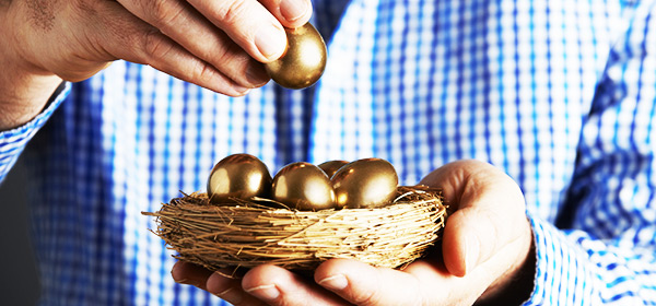 man putting golden eggs into one nest